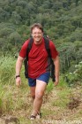 Dr Craig hoofs it uphill
at Chatham Bay